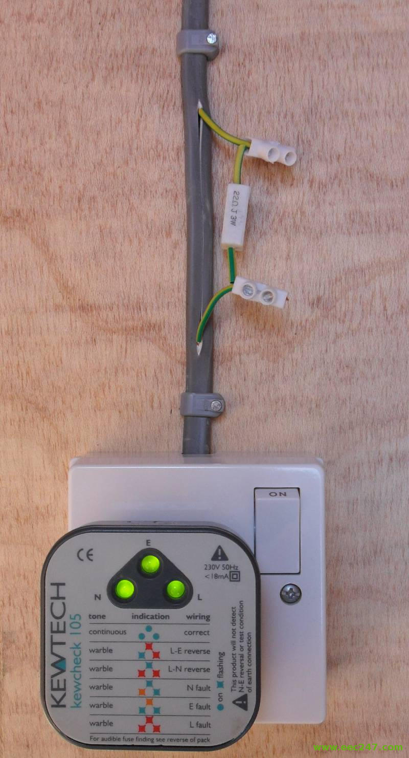 A plug in mains tester with three lights to find faults