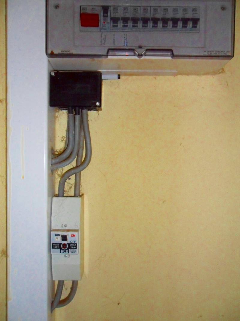 A consumer unit fitted in the 1990s, where an RCD has been fitted ahead of the consumer unit