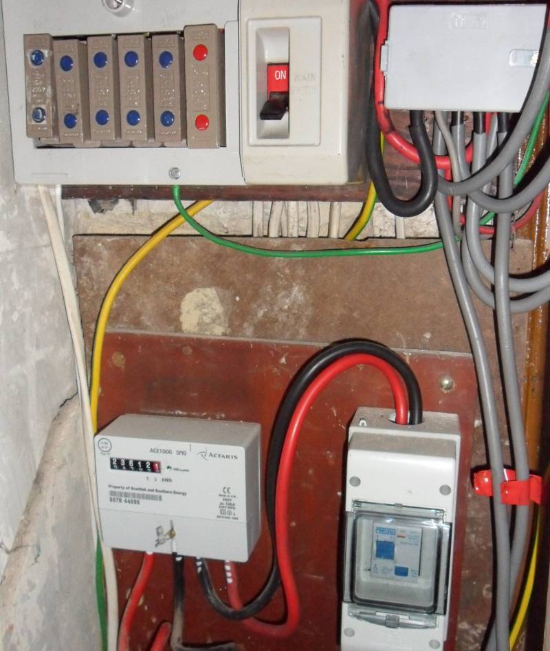 A front end RCD fitted to a fusebox with porcelain fuse carriers