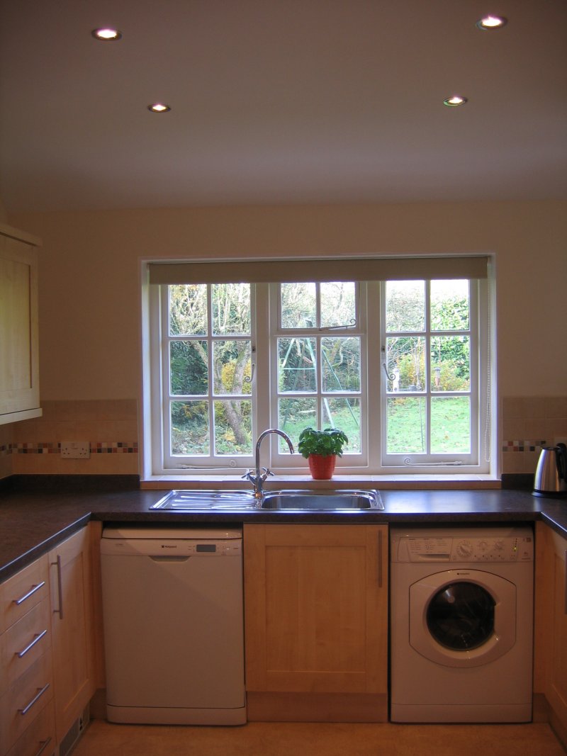 Down lighting gives an even spread of lighting throughout the kitchen