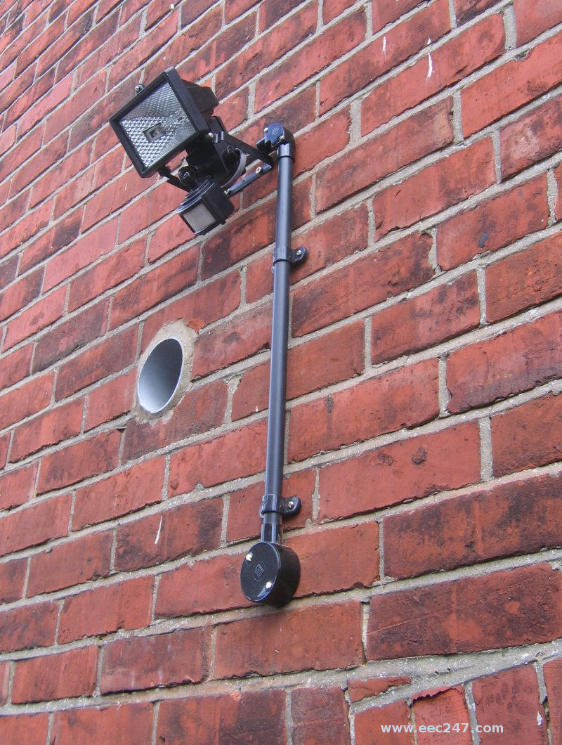 Floodlight in passageway between house and garage