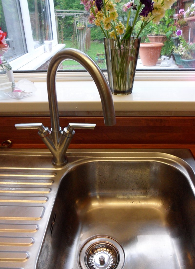 Kitchen taps in the on position with electrically operated valved closed when kitchen is unoccupied