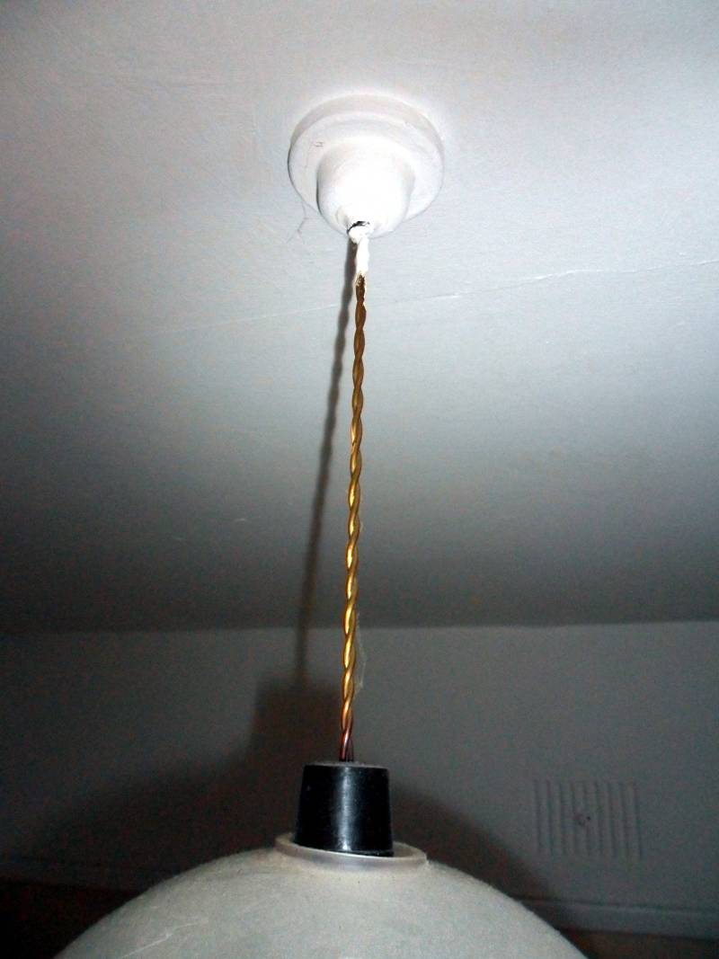An original 1950s light pendant, complete with nylon covered flex