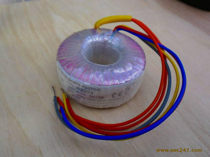 photograph of a toroidal transformer